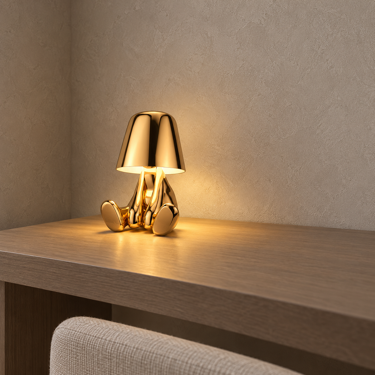 Sarovel gold cordless table lamp switched on at the corner of a clear study desk