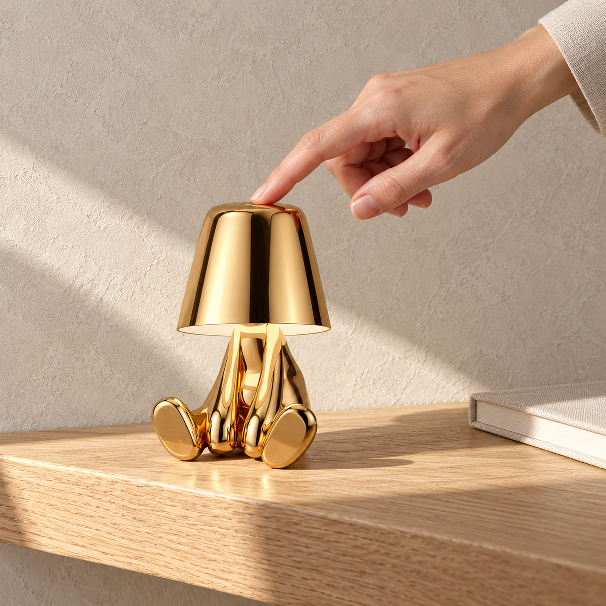 Sarovel gold portable table lamp resting unlit on a sunlit entryway shelf like a small sculpture