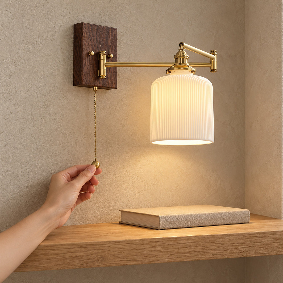 Selanvo gold and white plug in wall lamp turned on with a hand pulling its pull chain switch