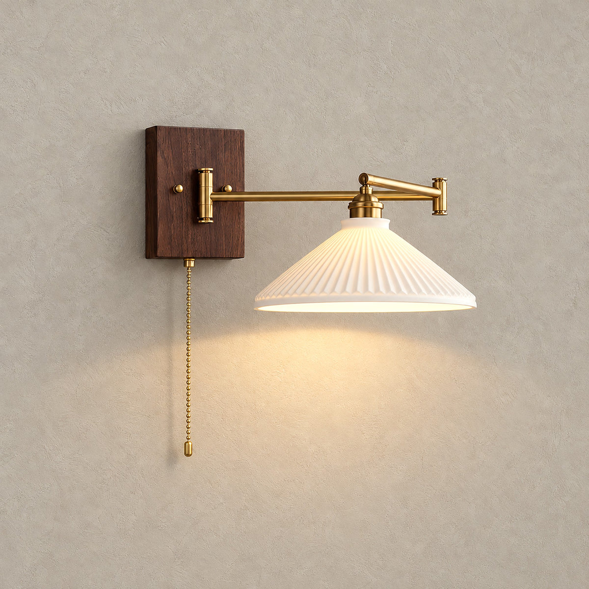 Selanvo gold and white plug in wall light in the wide cone model, switched on against a plain backdrop