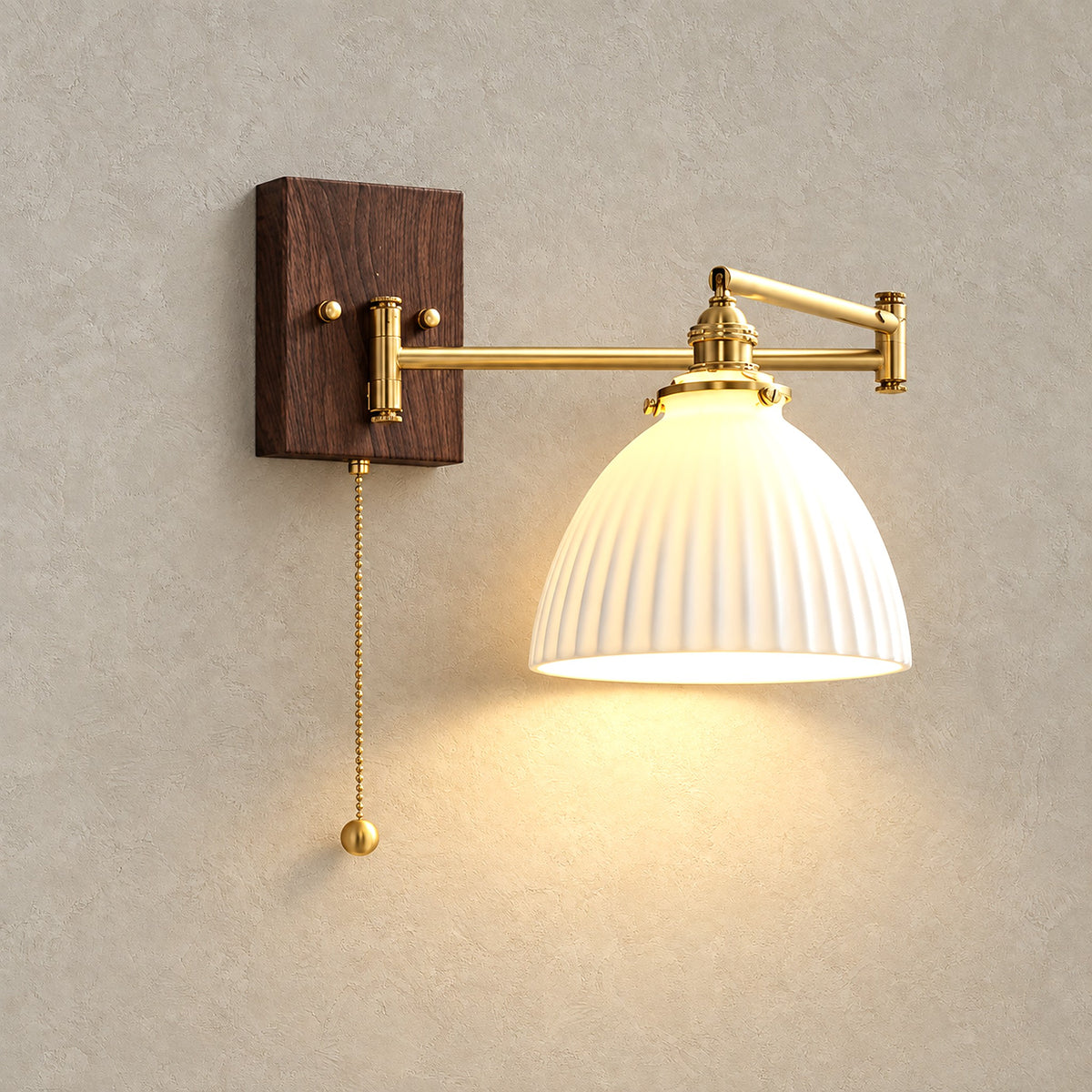 Selanvo gold and white plug in wall sconce in the bell model, lit, on a plain backdrop