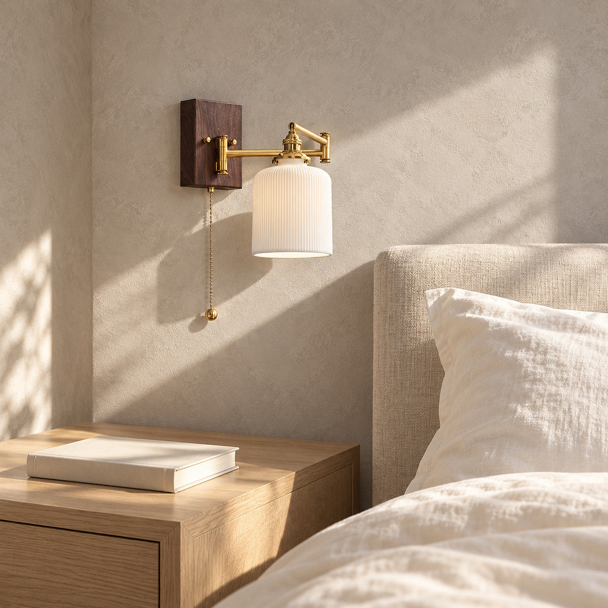 Selanvo gold and white wall sconce folded back against the wall in a sunlit sleeping alcove, switched off
