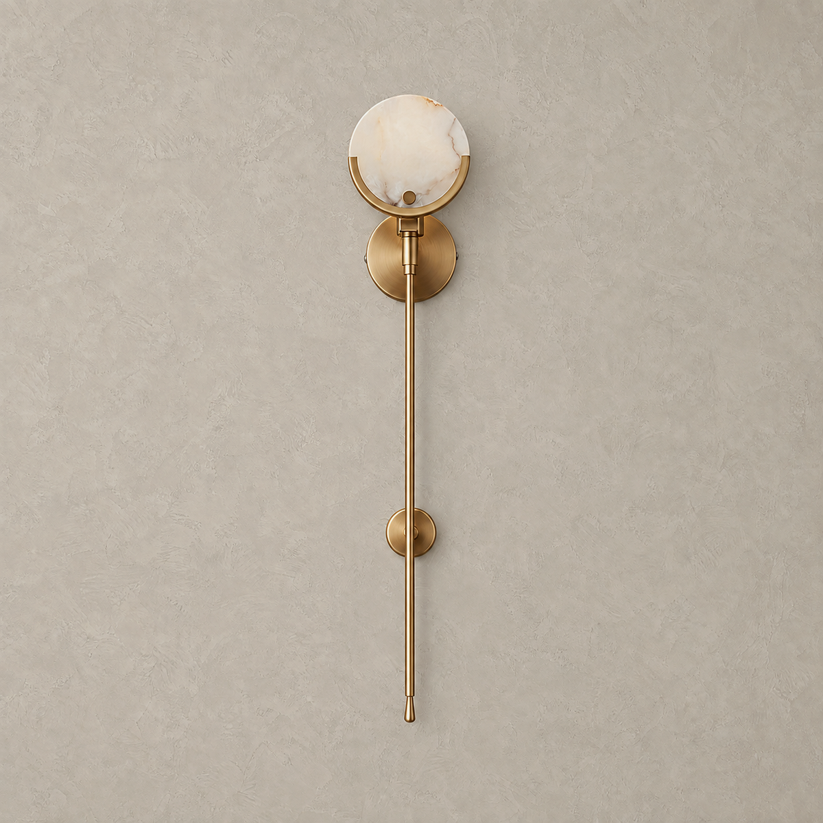 Serrinte wall sconce in brass finish with white stone shade, shown off against a plain background