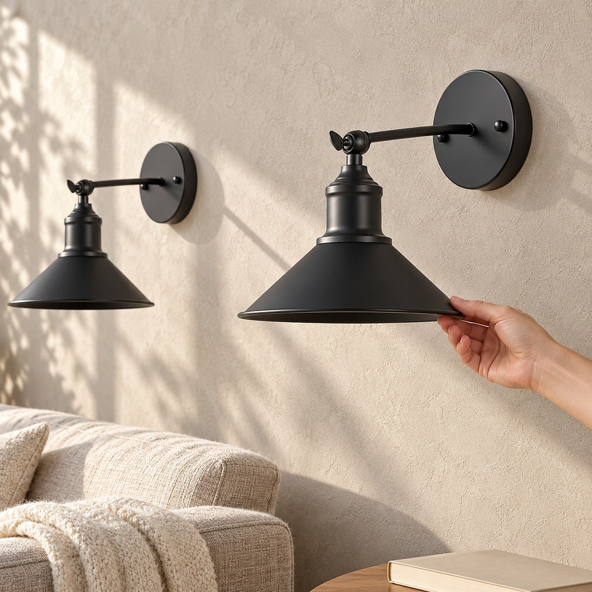 Sevarlo black battery operated wall sconce pair mounted beside a sofa in a sunny living room