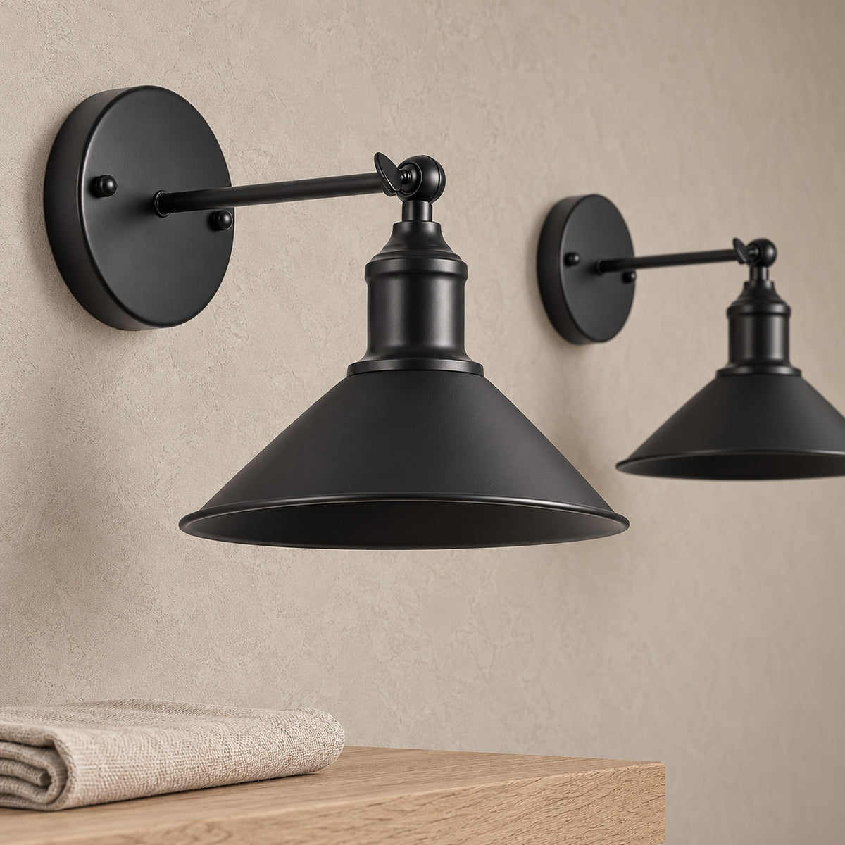 Sevarlo black wall sconce close up of the shade rim and arm joint in a dining nook