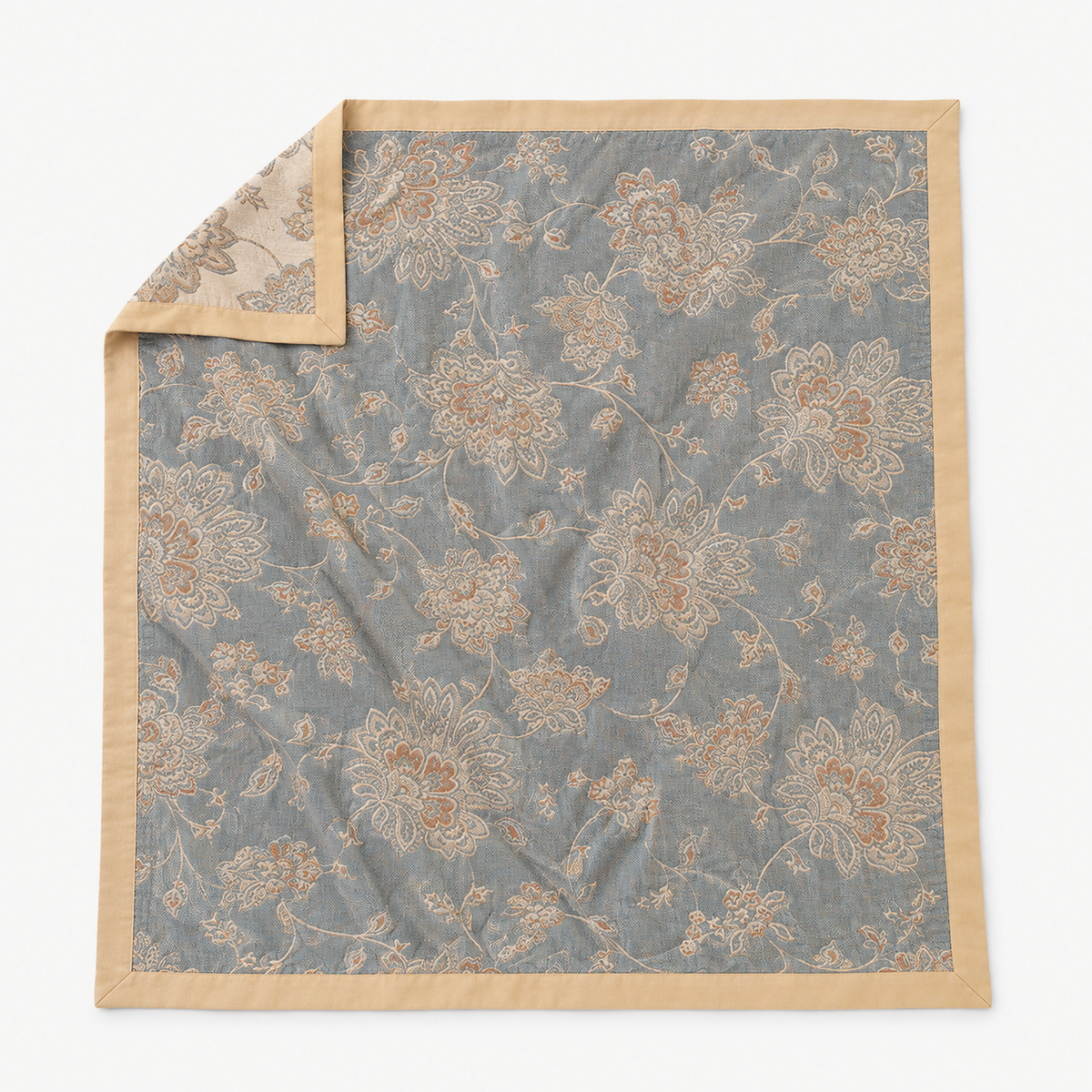 Sevirno blue cotton jacquard blanket laid open to show its full woven peony and vine floral face