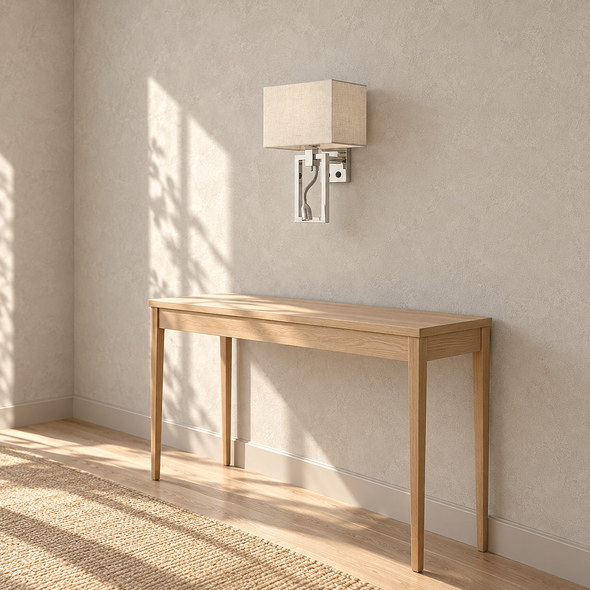 Silarno chrome wall light switched off above a clear console table in a daytime entry hall
