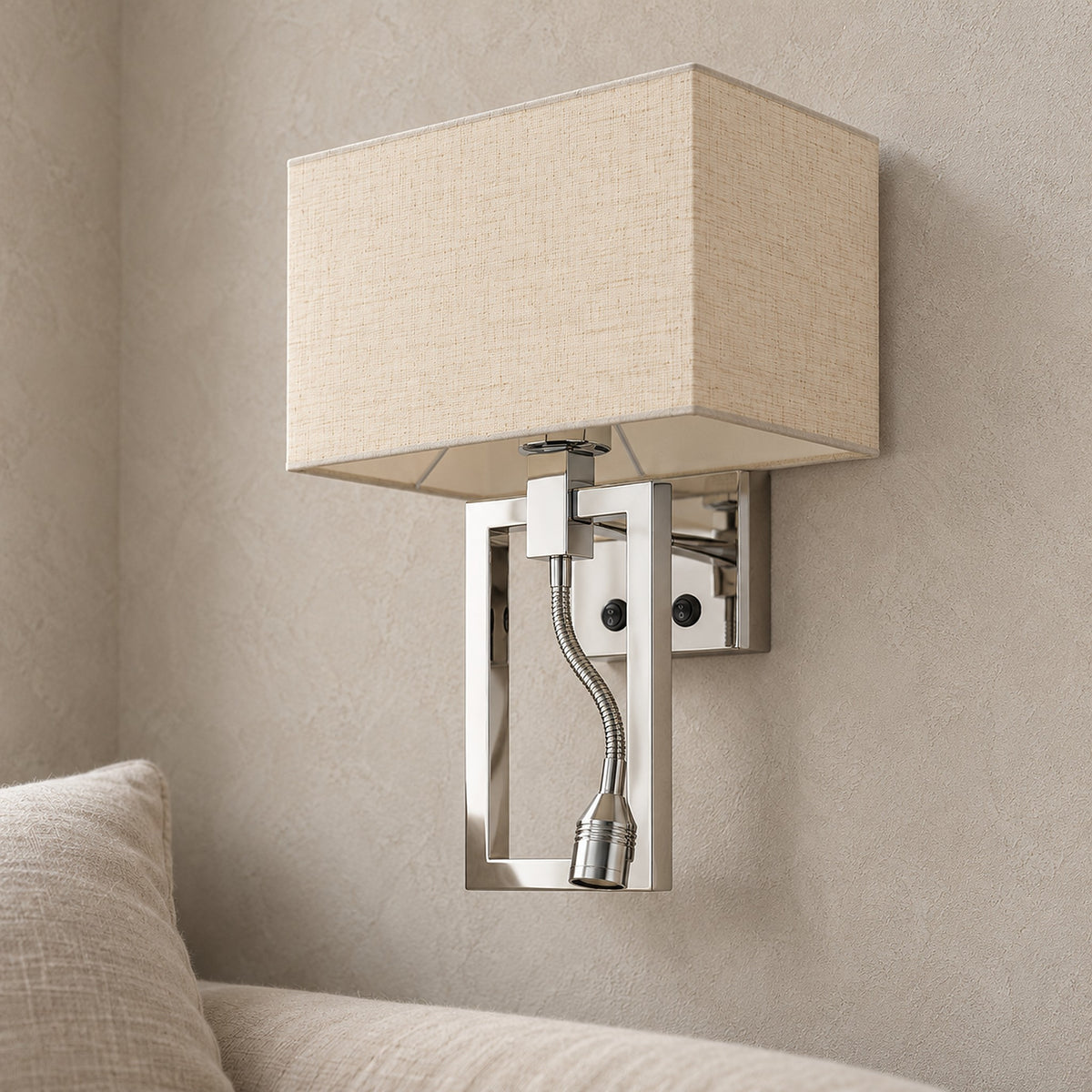 Silarno chrome wall sconce detail of the white fabric shade and reflective stainless steel support