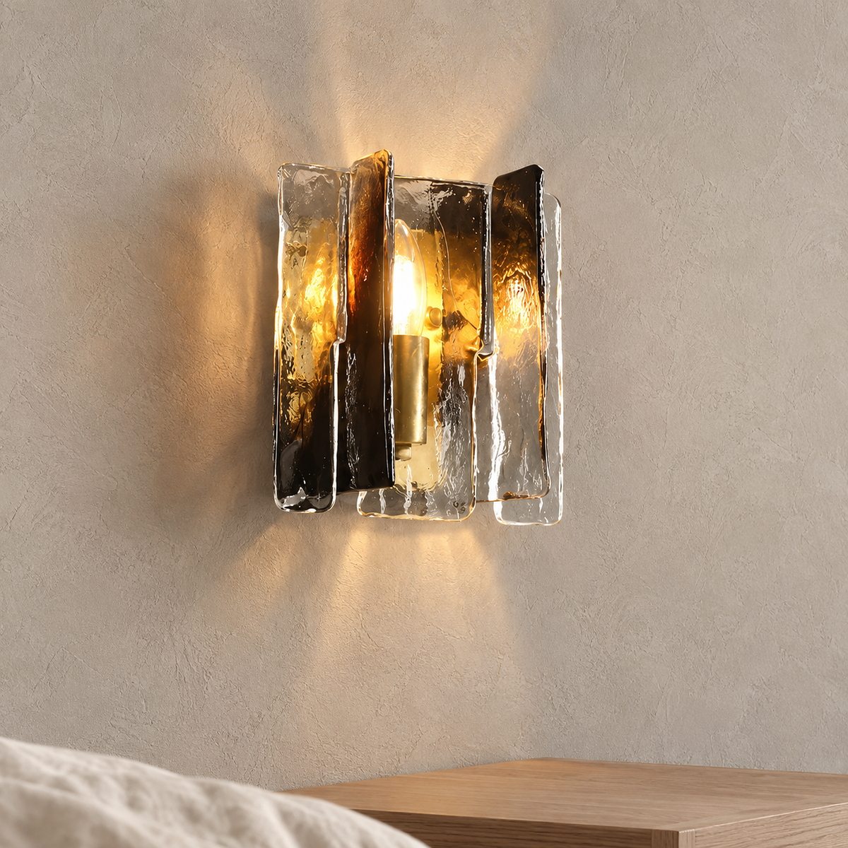 Simaelo black bedside wall light glowing warm above a clear nightstand in daylight