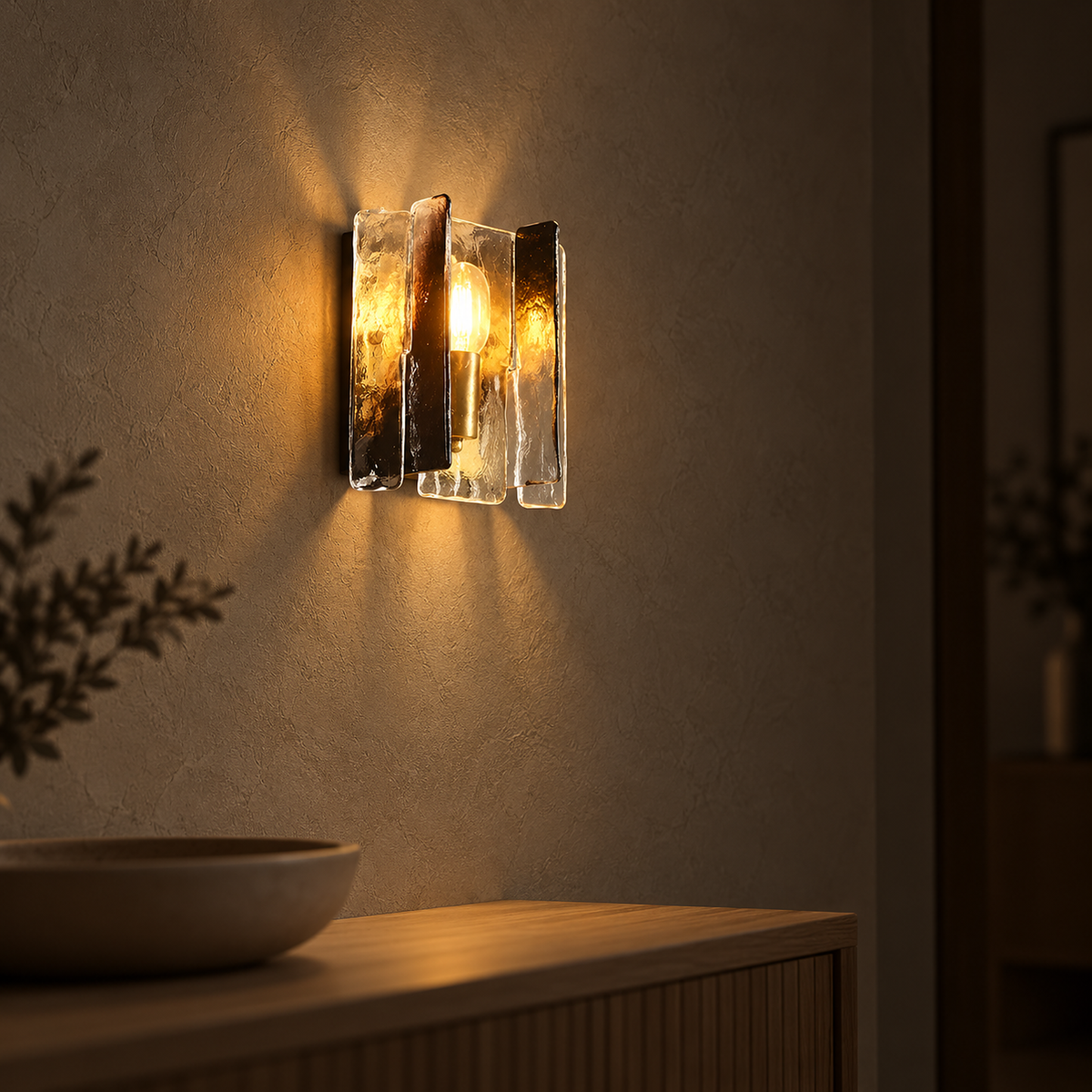 Simaelo black glass wall light seen from the side with its overlapping panels lit