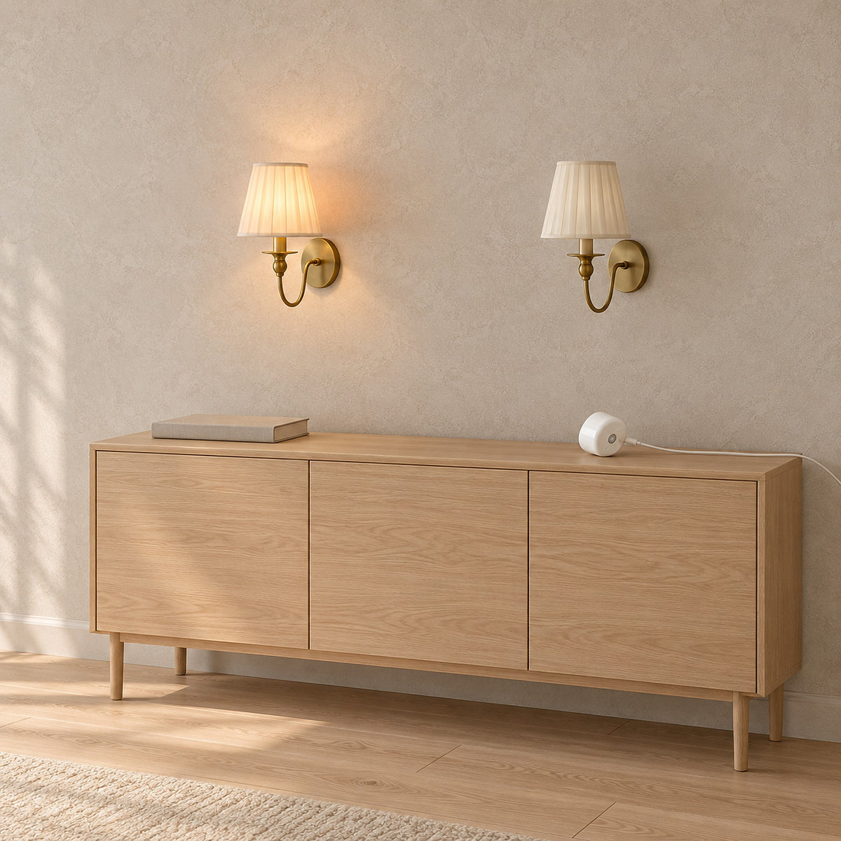 Siralto gold rechargeable wall sconce pair with its bulb charging in a dining room