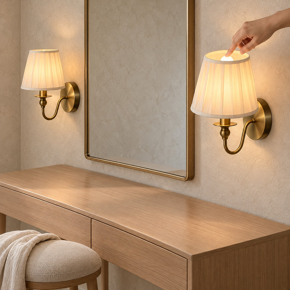 Siralto gold wall sconce bulb touched to dim the light in a dressing room