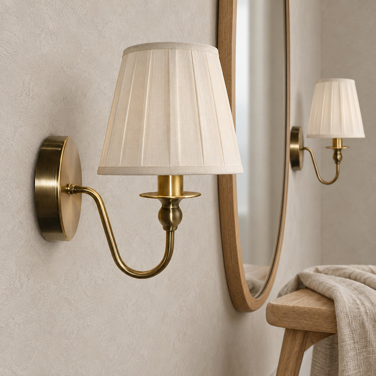 Siralto gold wall sconce close up of the fabric shade and iron body in a dressing room