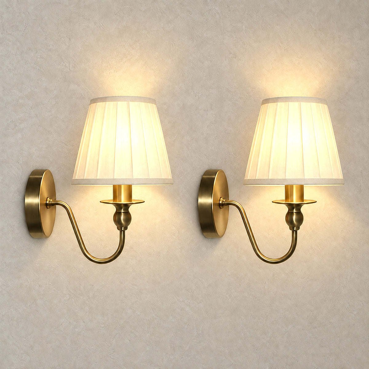 Siralto gold wireless wall light pair glowing warm white through fabric shades