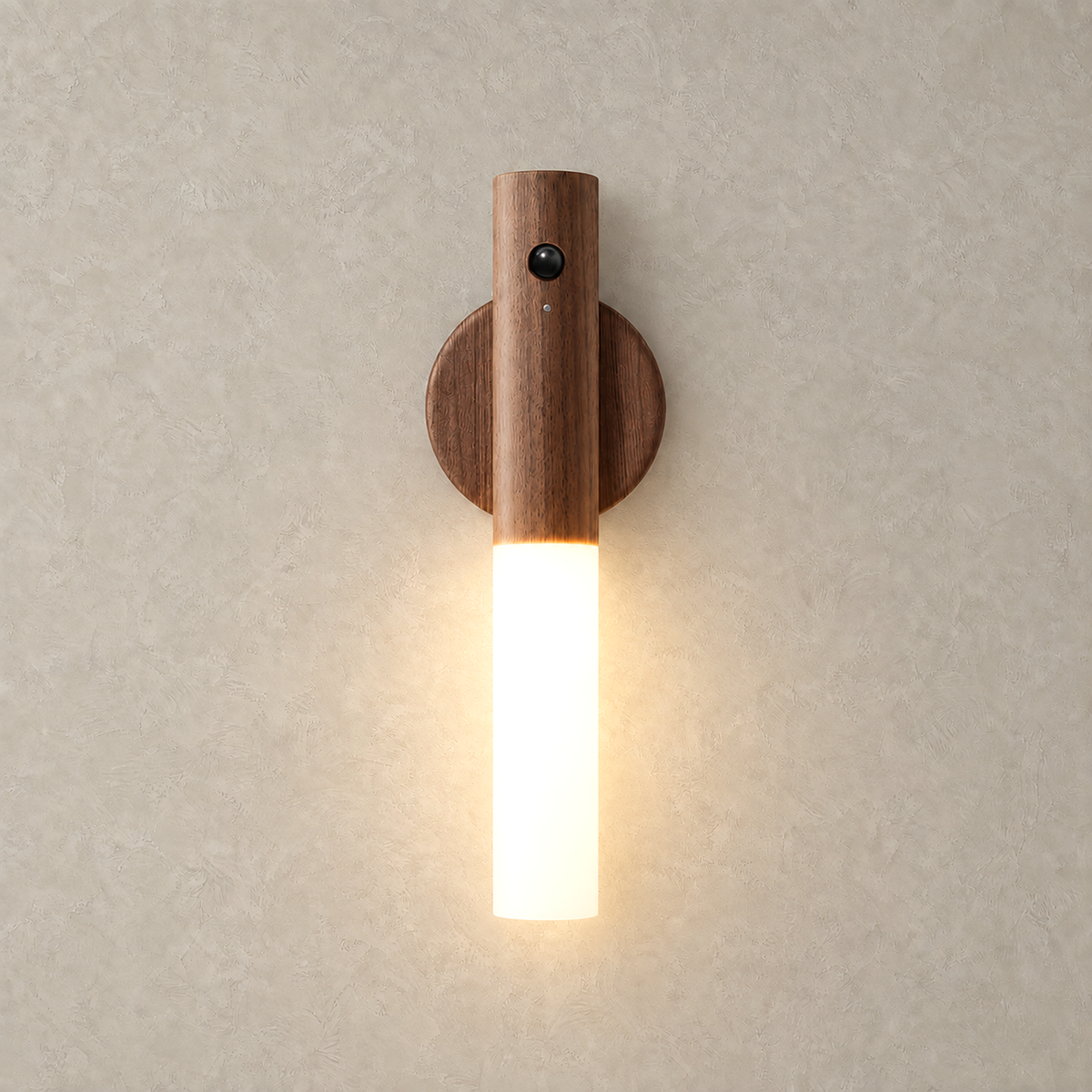 Solavre walnut bedside lamp lit on a plain plate with its frosted acrylic diffuser glowing