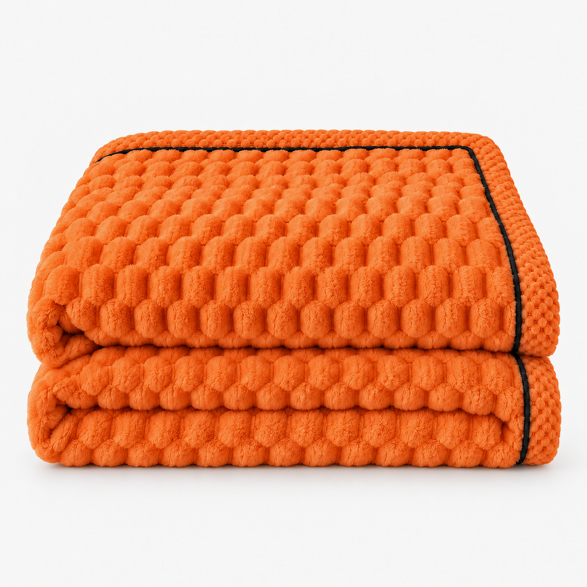 Somarel orange soft throw blanket loosely folded on a plain studio backdrop with its raised dots in view #color_orange