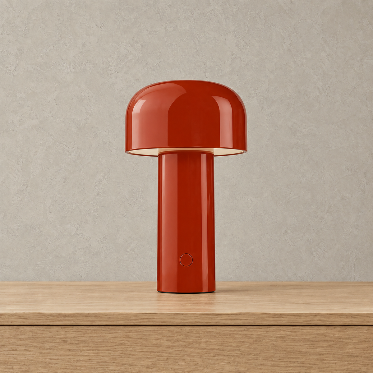 Sorimel rechargeable mushroom lamp in red, unlit on a pale surface against a plaster wall
