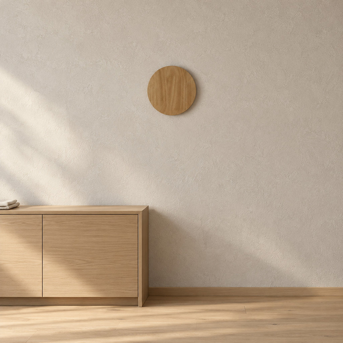 Sorivan light brown wall lamp unlit above a living room cabinet corner, round wood shade
