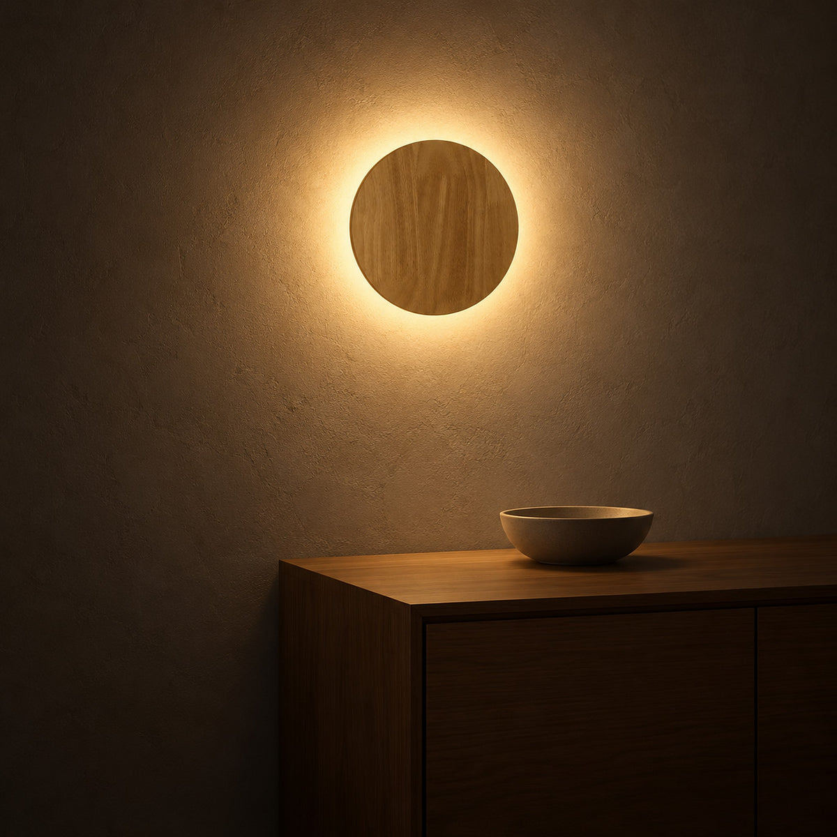 Sorivan light brown wall light casting a warm ring over a dining room sideboard at night