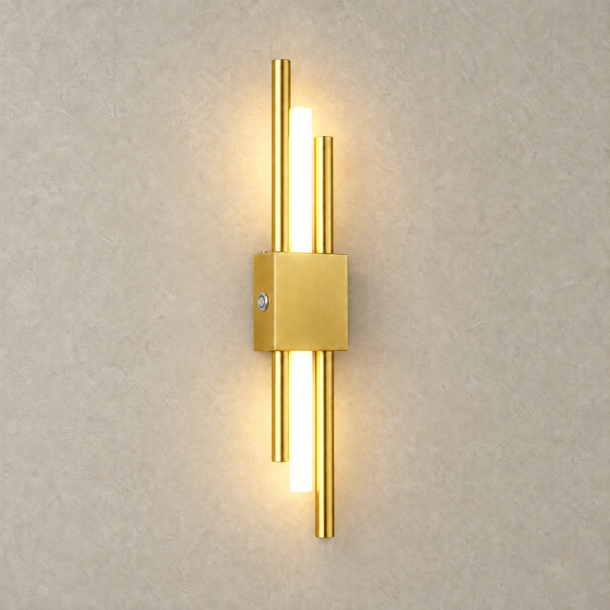 Sorlimo gold and white LED wall sconce glowing warm white against a plain plaster wall