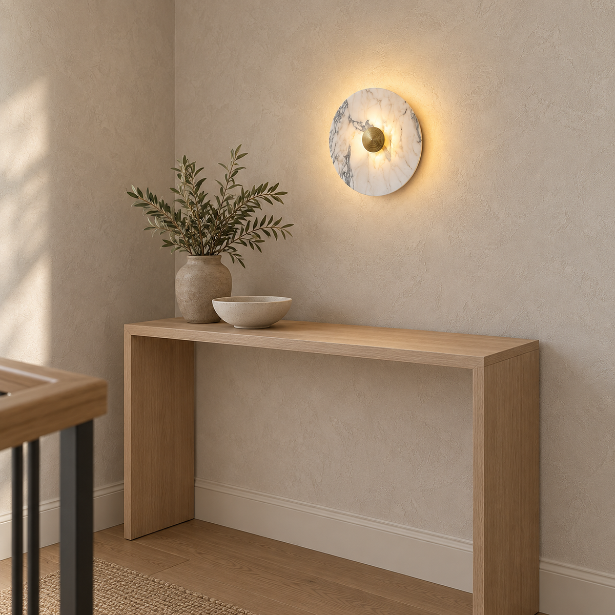 Talemio gold marble wall sconce glowing above a console on the upstairs landing #color_gold