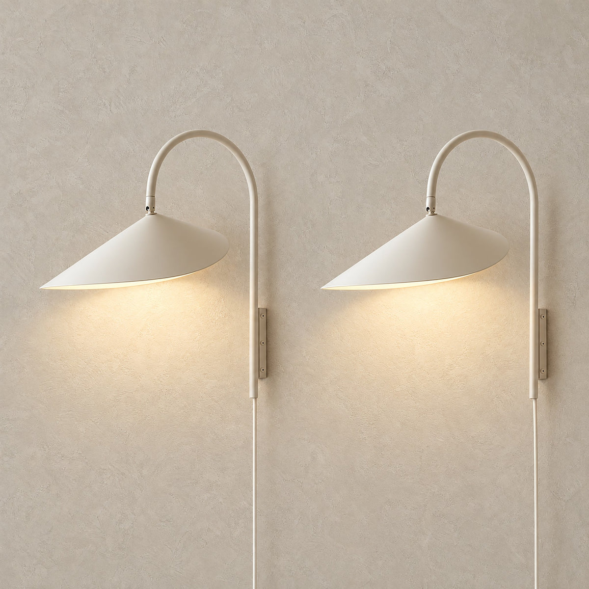 Talirsa beige plug in wall lamp set of two, a lit matching pair shown together #color_beige