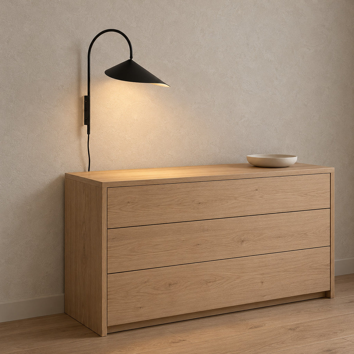 Talirsa black plug in wall lamp mounting plate with the cord running down the wall of a dressing room