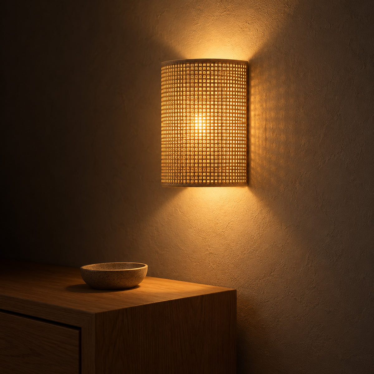 Talmevi light tan plug in wall lamp with a woven shade lighting an entry nook at night