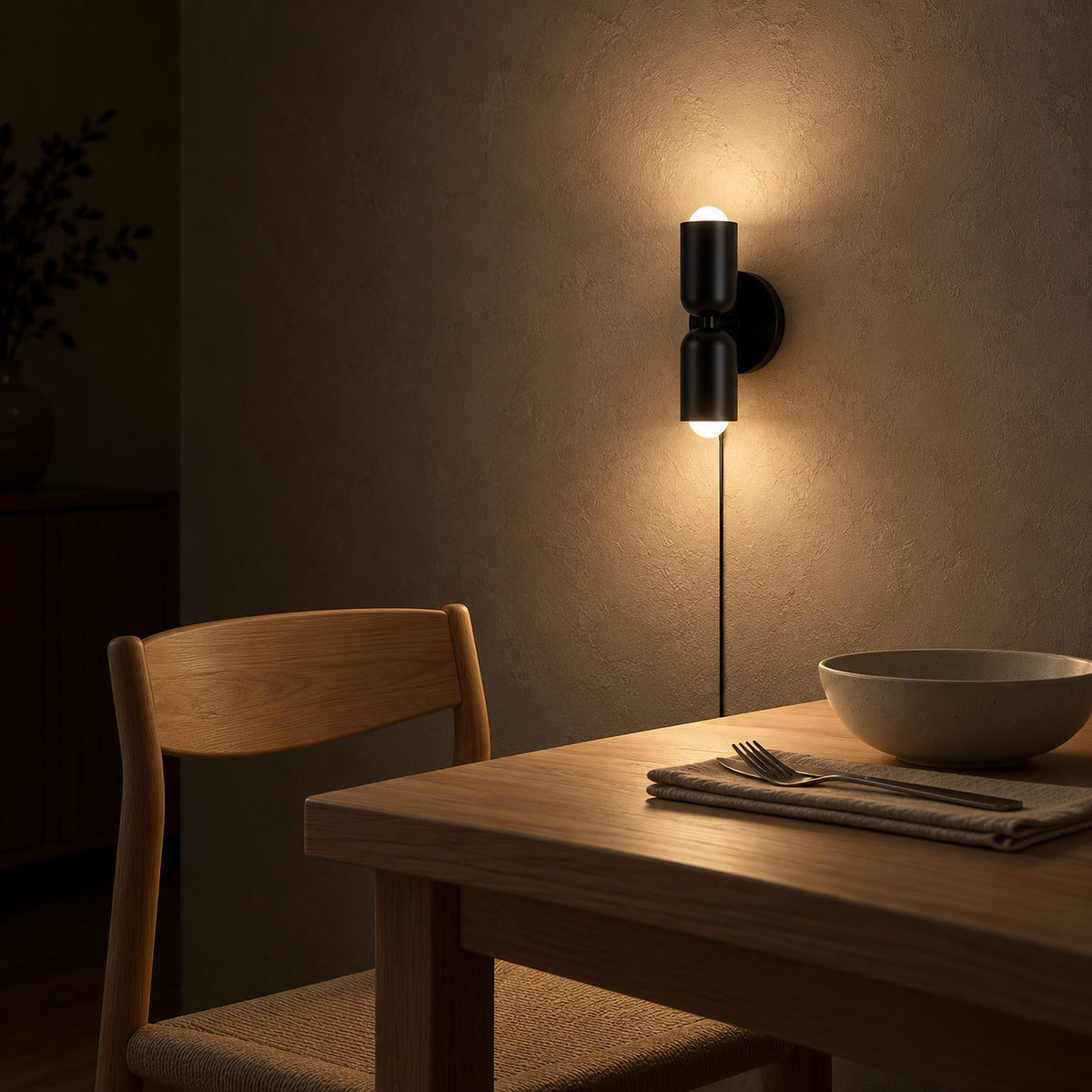 Talomi black plug in wall sconce lighting an evening dining corner #color_black