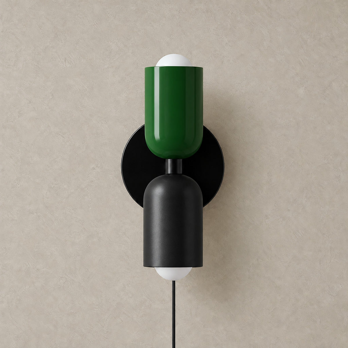Talomi green and black plug in wall sconce unlit on a plain backdrop showing its finish #color_green & black