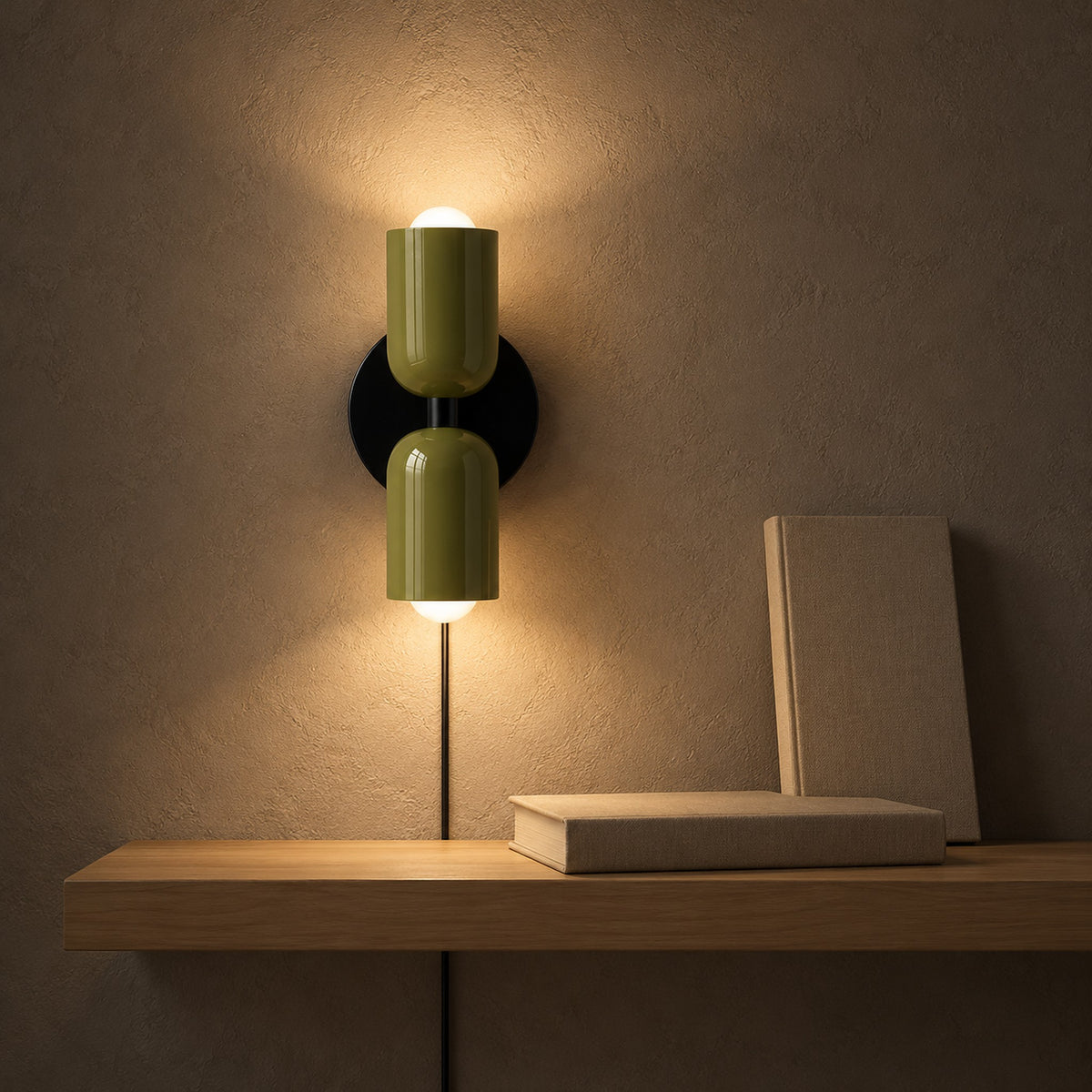 Talomi green plug in wall sconce lighting a hallway shelf with warm upward and downward pools at night #color_green