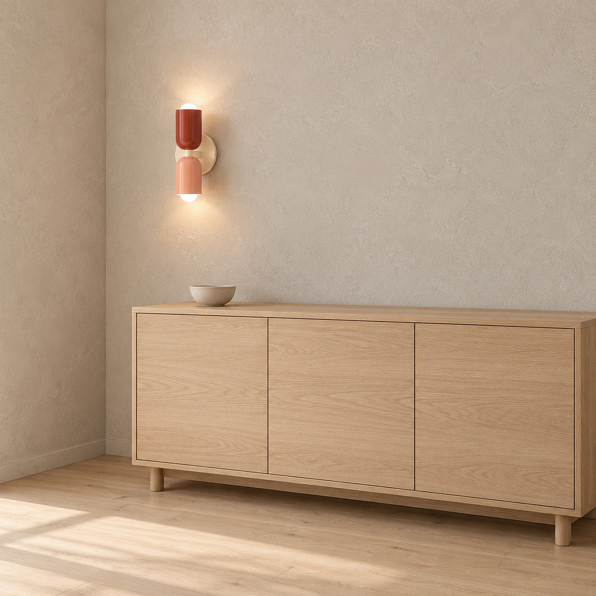 Talomi pink and red and beige base plug in wall light lit above a dining sideboard #color_pink & red & beige base