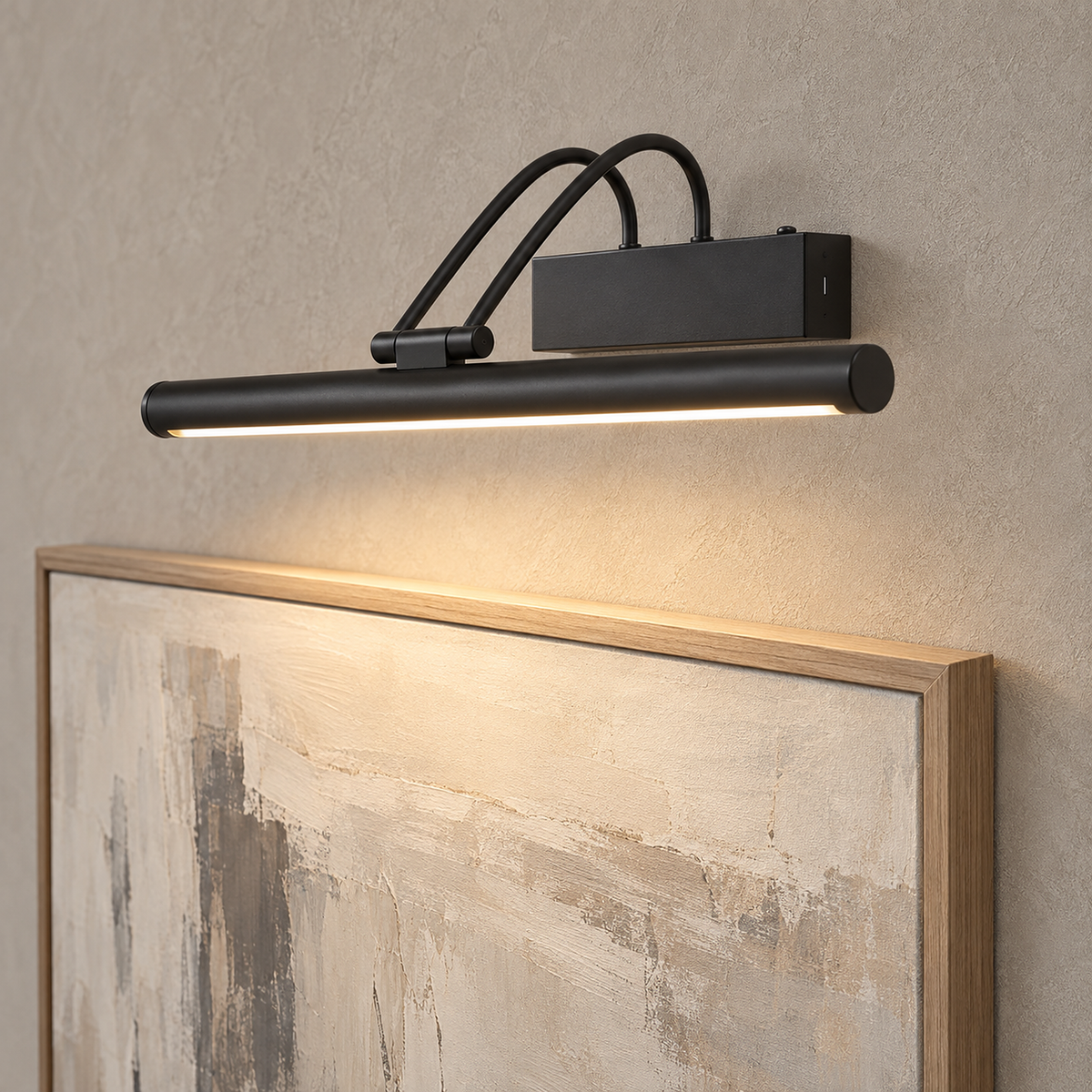 Tamirel black LED wall sconce in near profile with curved arms reaching over lit artwork