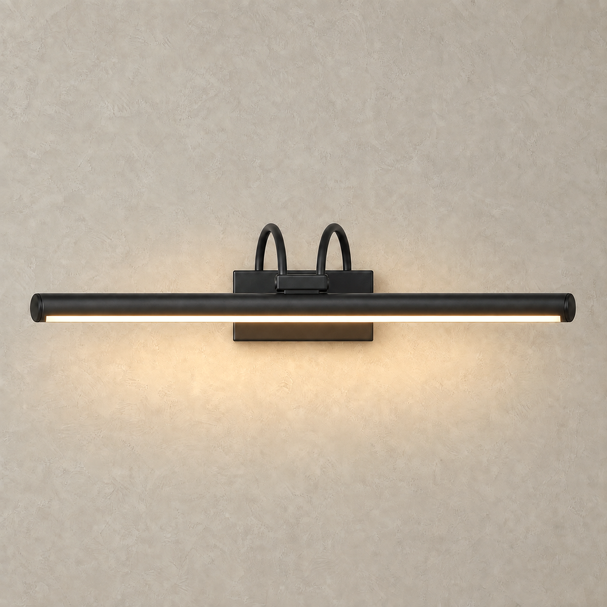Tamirel black wireless wall light casting a warm downward wash over the wall below