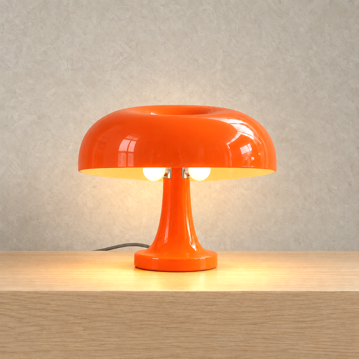 Tamolise mushroom table lamp in orange, lit in the same studio plate composition
