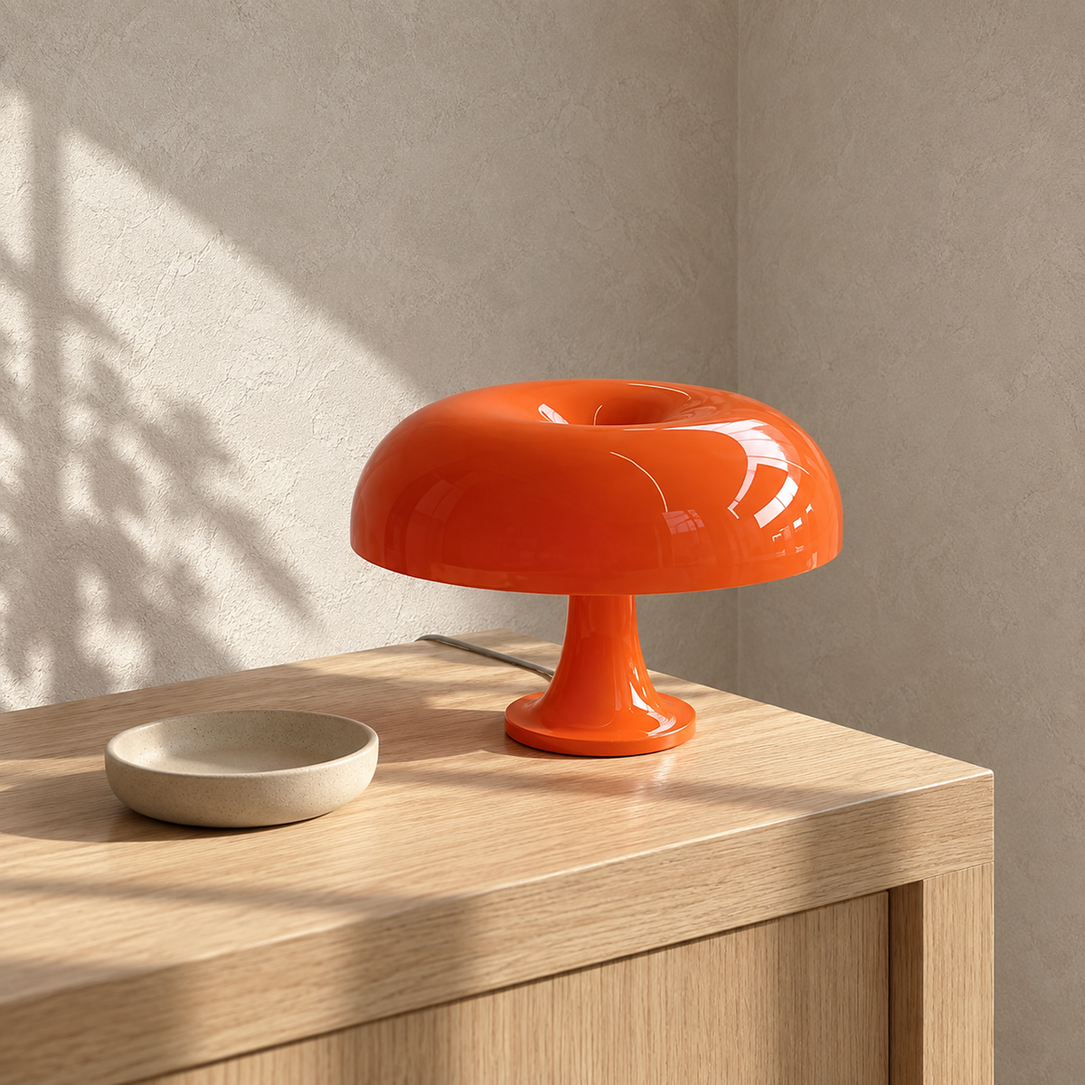 Tamolise orange table lamp unlit on a sunlit entryway console in daylight