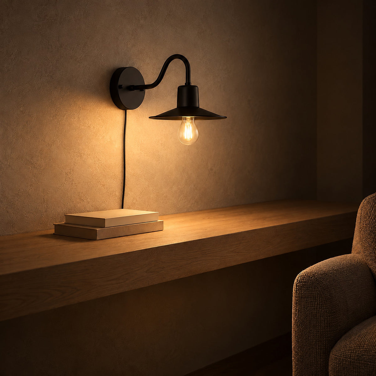 Tarelio black wall sconce lit and glowing beside library shelves at night