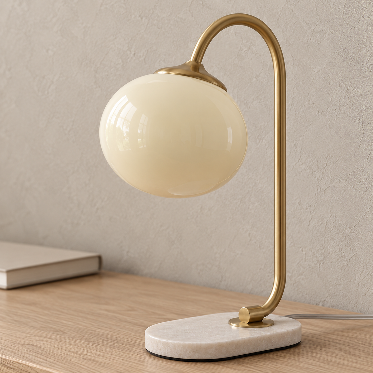 Taselvo gold and beige bedside lamp, close detail of the stained glass shade, unlit in a study