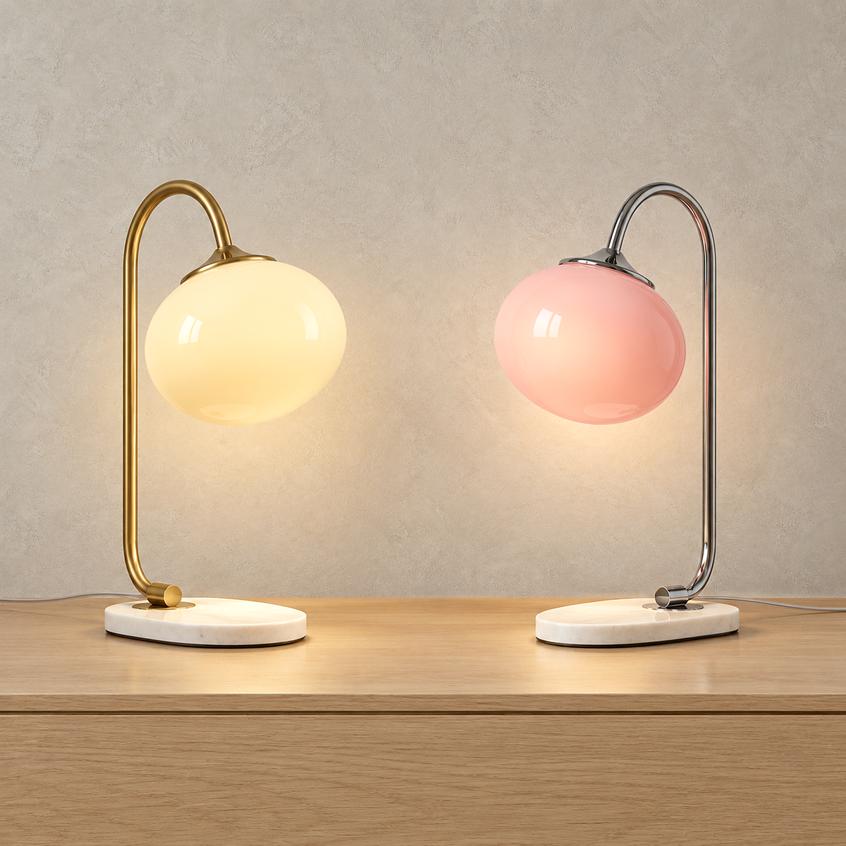 Taselvo plug in table lamps in gold and beige and in chrome and pink, lit side by side