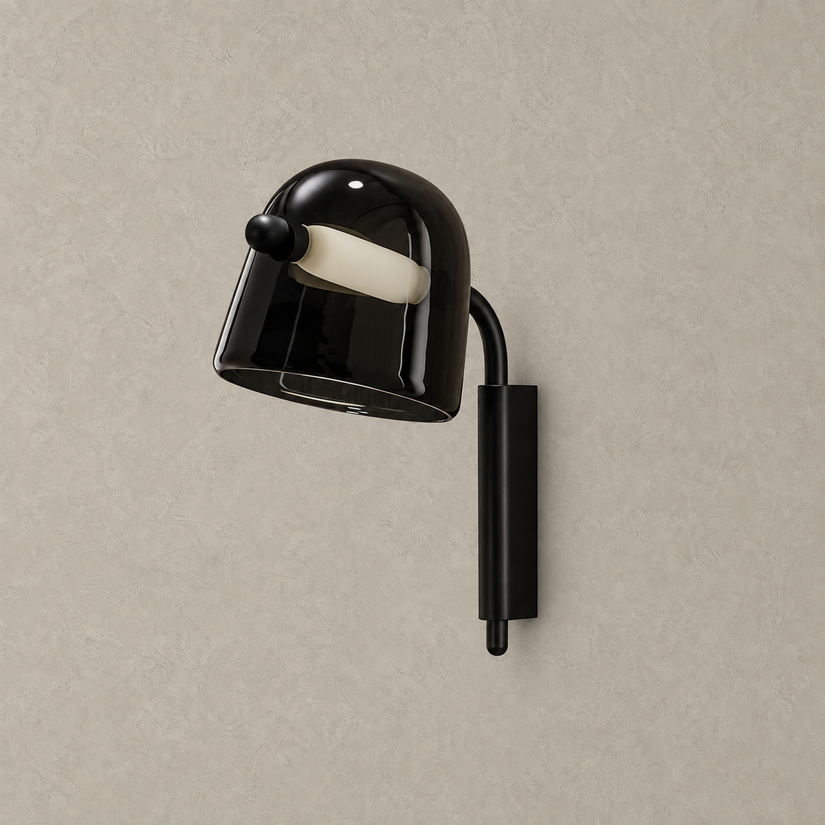 Tavessi black glass wall sconce unlit on a plain plaster wall backdrop
