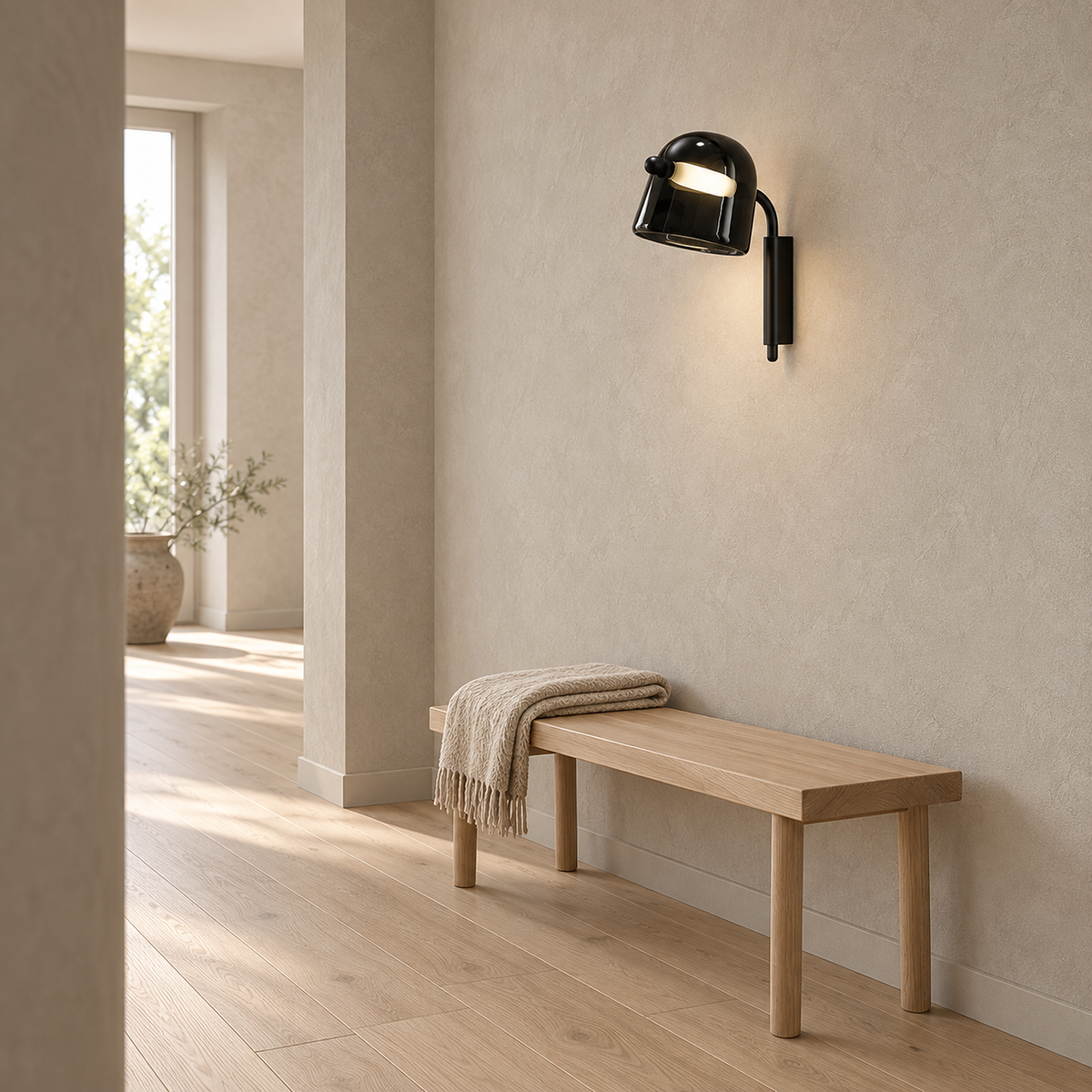 Tavessi black LED wall sconce in a hallway with no visible cable