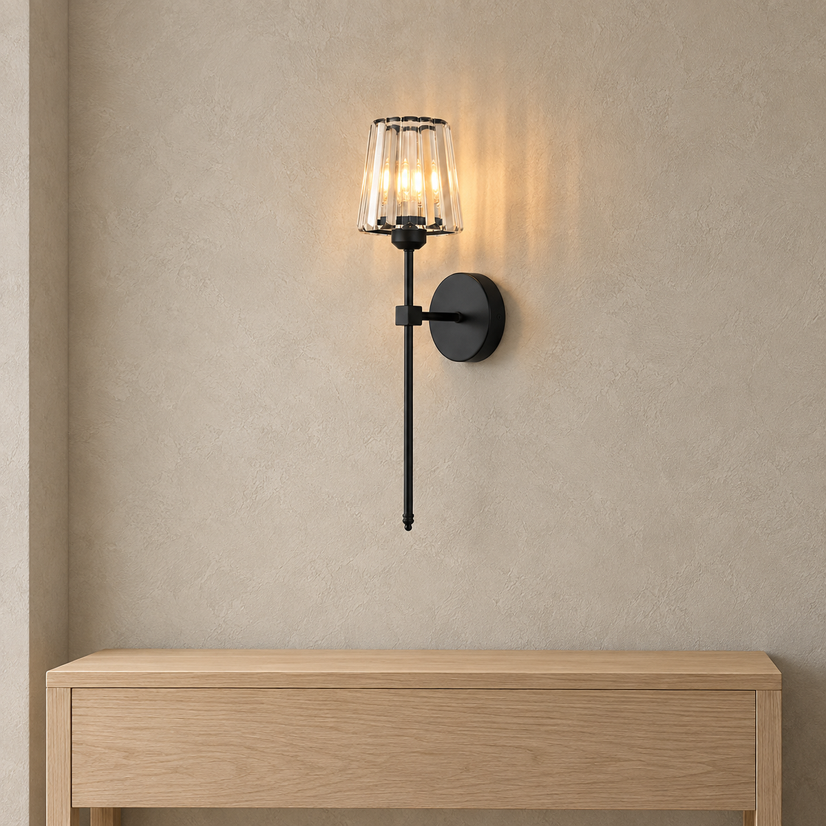 Tavirelo black rechargeable wall sconce lit above an entryway console with its round 12 cm backplate