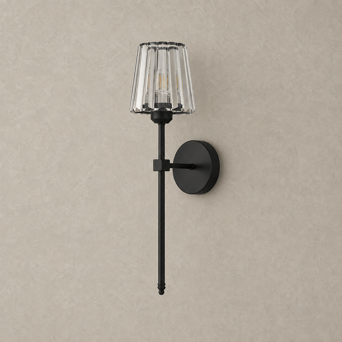 Tavirelo black rechargeable wall sconce unlit against greige plaster showing its crystal shade