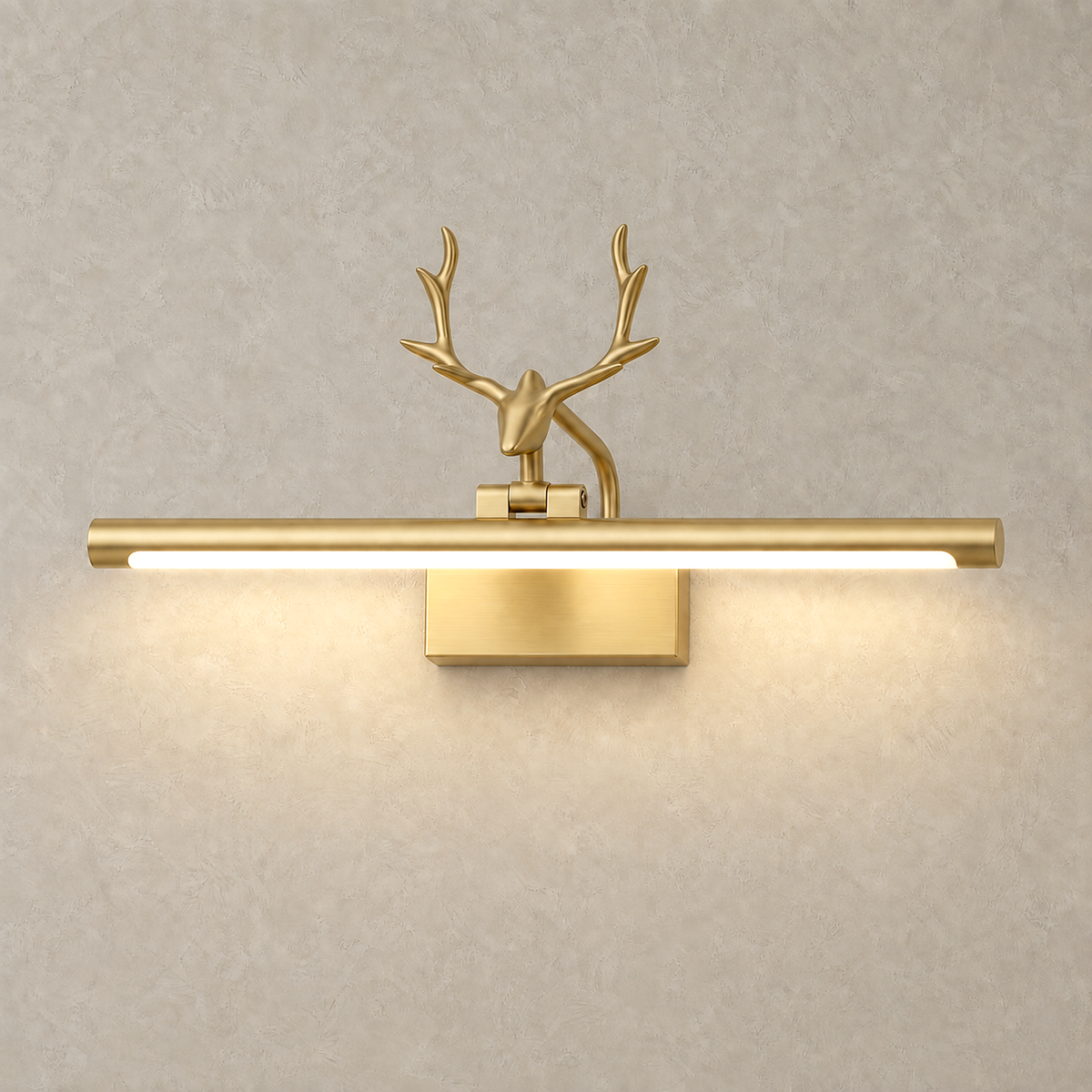 Tavorni gold led wall sconce with acrylic shade glowing on a plaster wall