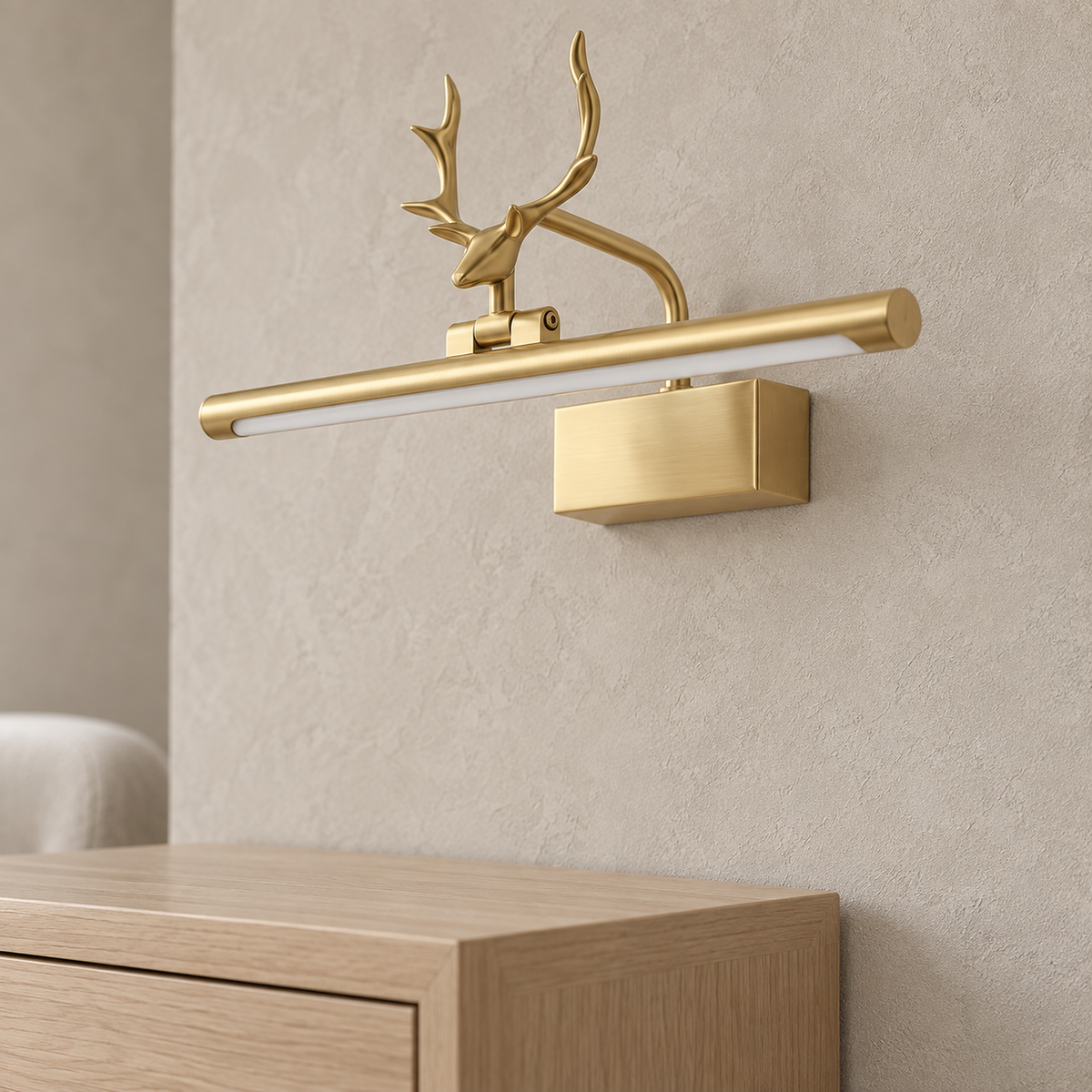 Tavorni gold wall light close up on the antler arms and acrylic underside