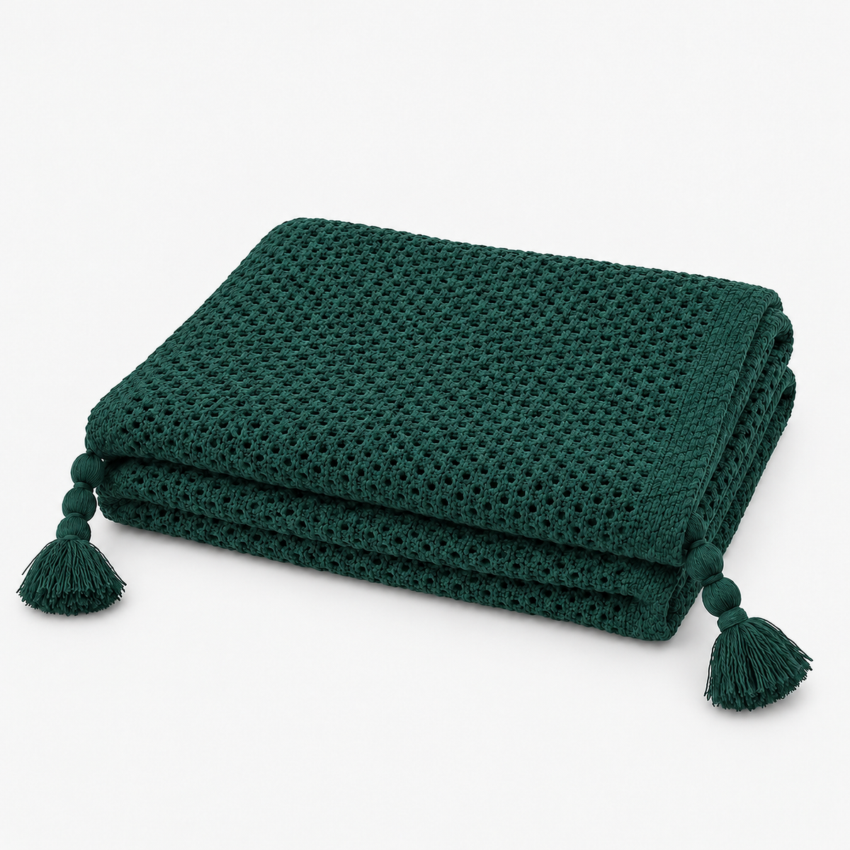 Tevolin green soft throw blanket folded with matching textured tassels at each corner #color_green