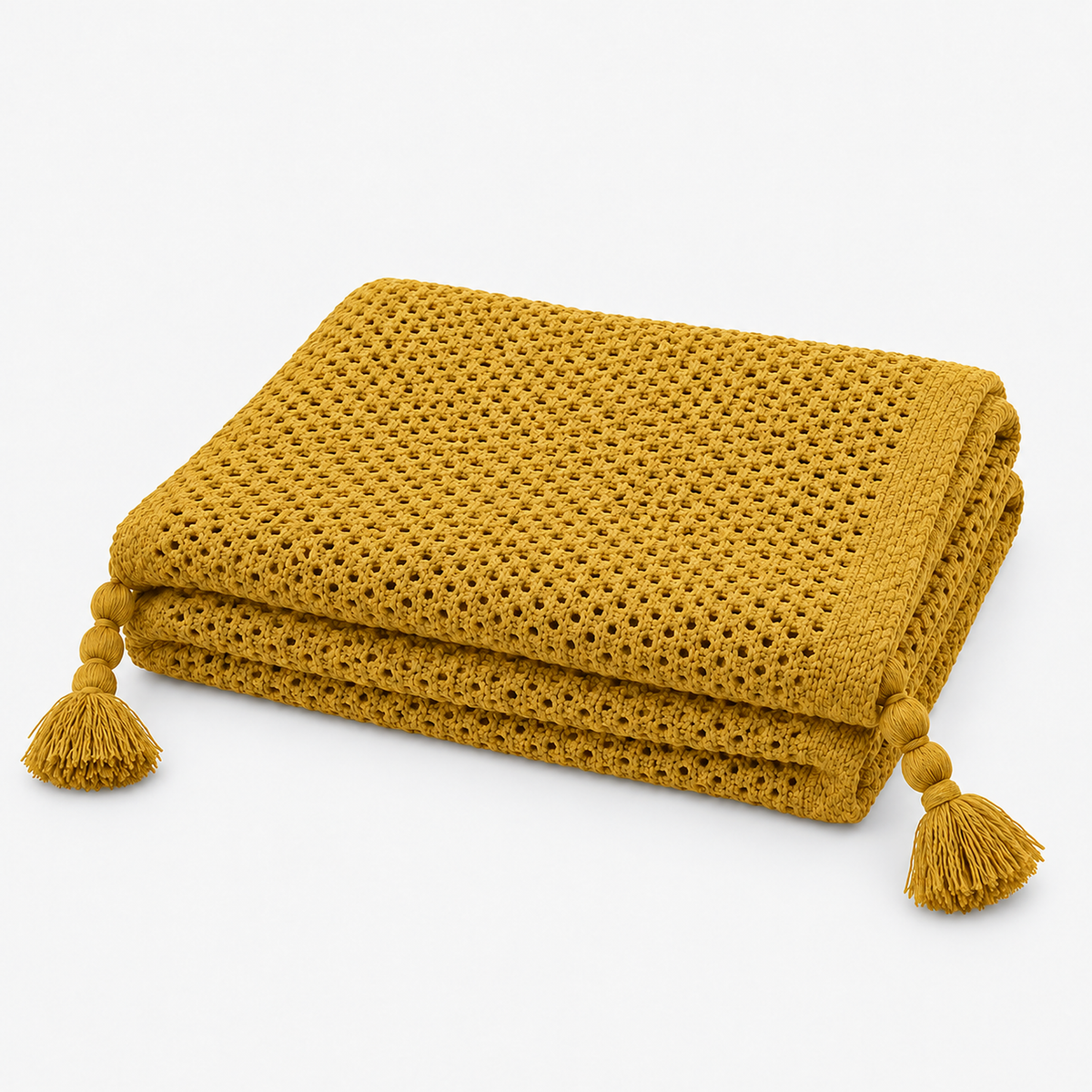Tevolin yellow throw blanket folded with matching large yarn tassels at the corners #color_yellow