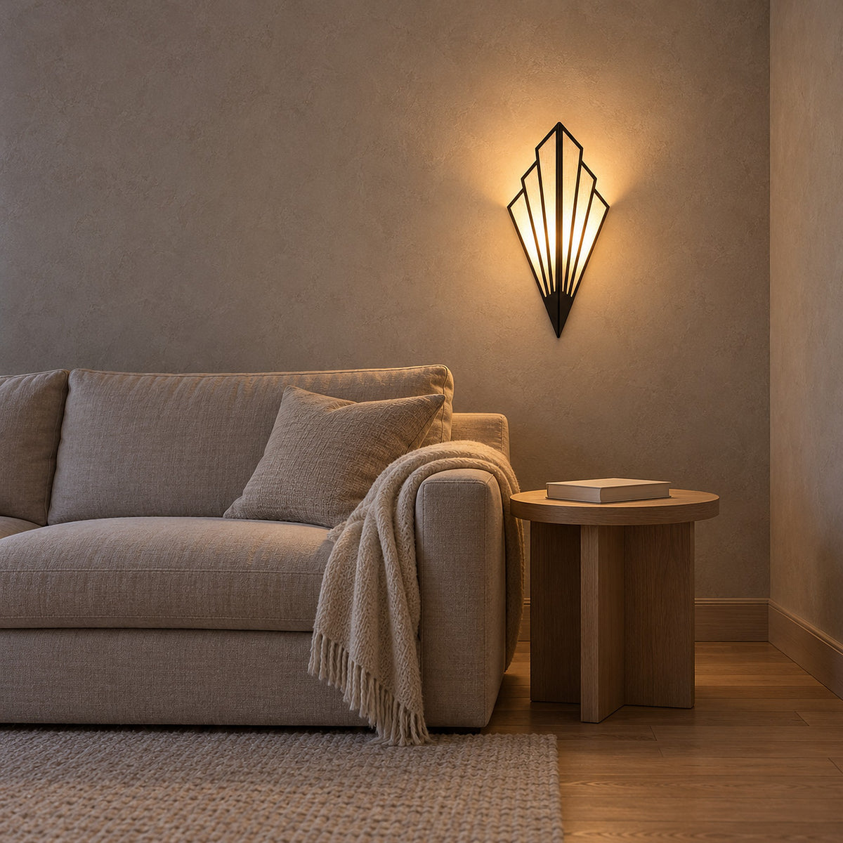 Ticorena black wall light glowing beside a sofa in a living room