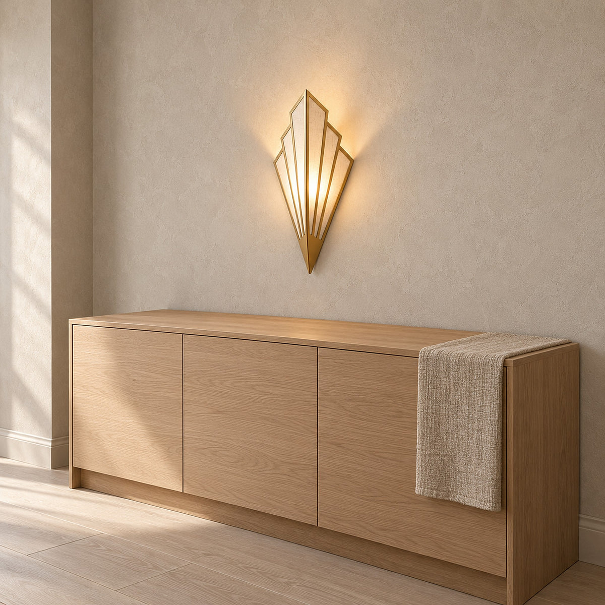 Ticorena gold plug in wall light glowing above a sideboard in a daylit dining room #color_gold
