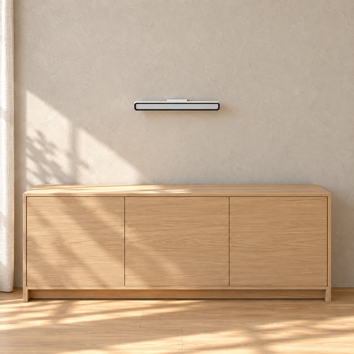 Tirelan white battery operated wall sconce unlit above an entryway console in daylight